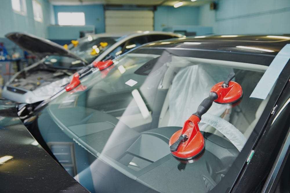 Auto Glass Repair, Windshield Replacement in Iowa City IA At Harv's Auto Body Repair. Cars at auto body repair shop for windshield replacement.